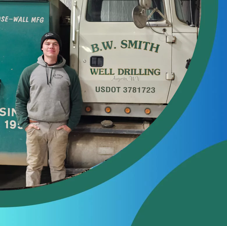 Technician standing beside B.W. Smith Well Drilling service truck in Augusta, WV